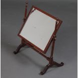 A Georgian rectangular plate dressing table mirror contained in a mahogany swing frame 50cm h x 43cm