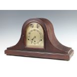 A German 8 day striking mantel clock with arched silvered dial and Arabic numerals, strike/chime