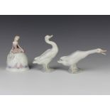 A Lladro figure of a goose 10cm, a ditto 12cm and a figural bell 12cm