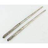 Two silver engraved quill pens, 37 grams