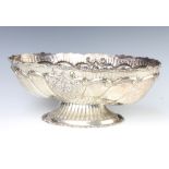A Continental 900 standard repousse oval fruit bowl decorated with flowers, 39 cm, 1245 grams