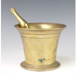 A 17th/18th Century brass mortar and pestle 11cm x 14cm