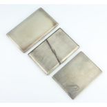 A silver engine turned cigarette case Birmingham 1950, 2 others, 660 grams