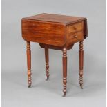 A Victorian mahogany drop flap work table, fitted 2 drawers and a cupboard enclosed by a flap,