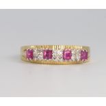 An 18ct yellow gold ruby and diamond ring 4.7 grams, size R