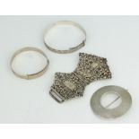 A silver buckle brooch and 2 bangles, 80 grams