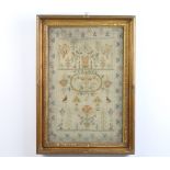 19th Century sampler with a country house, statuary and trees in a formal floral border with birds