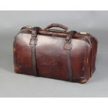 A brown leather Gladstone bag 30cm h x 60cm w x 27cm d There are some scuffs to the leather