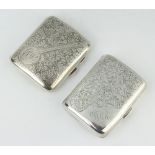 A silver chased cigarette case, Birmingham 1922 and 1 other, 120 grams