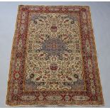 A North West Persian rug with white, blue and red ground, central medallion within a multi row