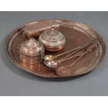 An Eastern circular copper charger 71cm, an engraved jar and cover and 1 other, brass ladle, 2