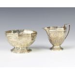 A Victorian octagonal repousse silver cream jug and sugar bowl London 1886, 200 grams