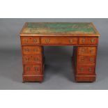 A Victorian mahogany desk with green inset writing surface above 1 long and 8 short drawers 73m h