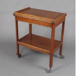 A 1930's Art Deco mahogany 2 tier tea trolley card table on pierced metal casters 75cm h x 61cm w