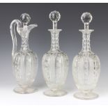 A pair of Edwardian mallet shaped decanters and stoppers 32cm and a matching ewer (cracked handle)