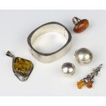 A silver bangle and minor silver jewellery 94 grams