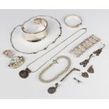 A silver bangle and minor silver jewellery 143 grams