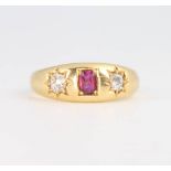 An 18ct yellow gold ruby and diamond gypsy ring, 4.6 grams, size N 1/2