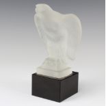 A moulded glass figure of an eagle raised on a square black base 22cm