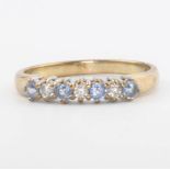 A 9ct yellow gold tanzanite and diamond ring, size L 1/2, 1.8 grams