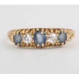 An 18ct yellow gold sapphire and diamond ring size T