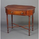 A Georgian octagonal crossbanded mahogany occasional table, fitted a frieze drawer, raised on turned