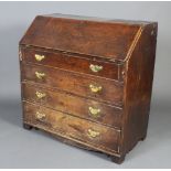 A Georgian country oak bureau, the fall front revealing a well fitted interior above 4 long