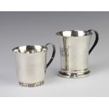 A silver mug of plain form, Birmingham 1939, a small ditto, 200 grams