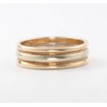 A 9ct three colour gold triple wedding band, size O, 4.9 grams
