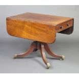 A Georgian mahogany pedestal Pembroke table, raised on a turned column and tripod base with brass