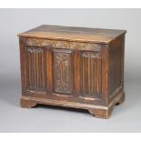 A 1920's oak coffer with linenfold decoration and hinged lid 60cm h x 76cm w x 46cm d There is a