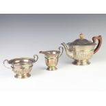 A silver 3 piece tea set with panelled body and beaded decoration Birmingham 1932, gross weight