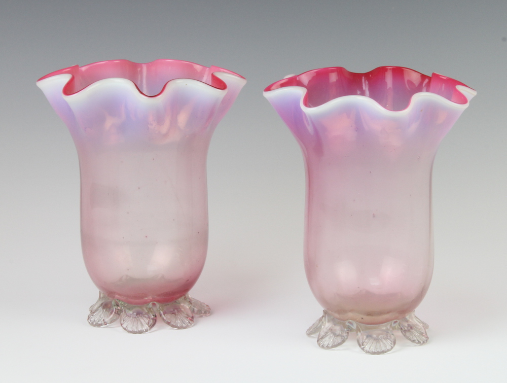 A pair of Victorian vaseline glass vases with wavy rims 16cm