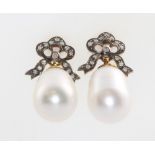 A pair of silver gilt cultured pearl and diamond earrings