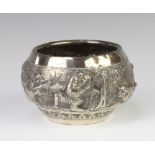 An Indian repousse silver bowl decorated with figures and elephants in a landscape setting, 12cm,