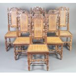 A set of 6 Victorian carved oak Carolean style high back dining chairs with woven cane seats and