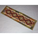 A black, green and brown ground Maimana Kilim runner 198cm x 58cm