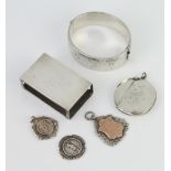 A silver bracelet and minor silver jewellery, 137 grams