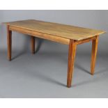A French oak and pine rectangular dining table raised on tapered supports 78cm h x 179cm l x 79cm