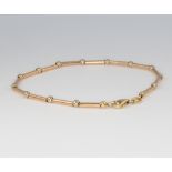 An 18ct yellow and white gold bracelet, 5.5 grams