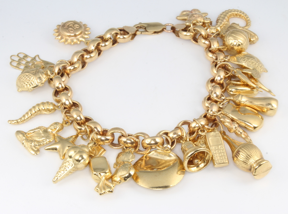 A 9ct yellow gold charm bracelet 27.9 grams