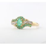 A 9ct yellow gold emerald and diamond dress ring, size P, 3 grams