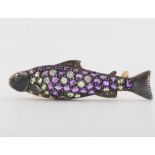 A silver gilt Edwardian style diamond and amethyst bar brooch in the form of a fish