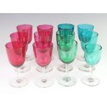 Six Victorian cranberry glass wine glasses and six matched green wines