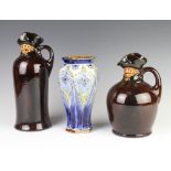 A Royal Doulton flask in the form of a gentleman 26cm, a small ditto 20cm and a hexagonal vase 20cm