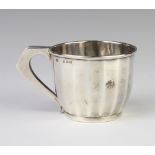 A panelled silver christening mug with angular handle Birmingham 1929, 77 grams