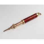 An Edwardian gilt and enamelled propelling pencil by S Morden & Co, 10cm There is a chip to the