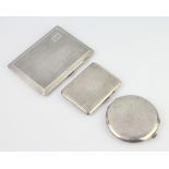 A large engine turned silver cigarette case Birmingham 1926, a smaller ditto Birmingham 1933 and a