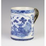 An 18th Century Chinese blue and white mug decorated with a panel of landscape, having a later metal