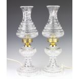 A pair of Waterford Crystal table lamps with waisted hobnail cut shades and splayed bases 50cm